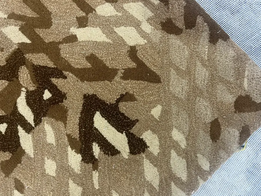 Close-up of a leaf-like abstract pattern in cream and brown